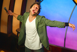 Cook introduces a 15-minute section on alcoholism and french fries during a 2005 performance.